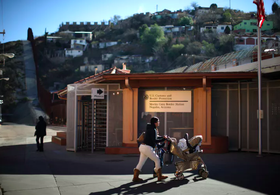 A woman walks toward the U.S. border port with Mexico in Nogales, Arizona. REUTERS/Lucy Nicholson