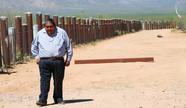 Verlon Jose, vice-chairman of the Tohono O'odham Nation, at the border barrier that traverses the Tohono O'odham reservation in Chukut Kuk, Ariz., in 2017. Reuters/Rick Wilking