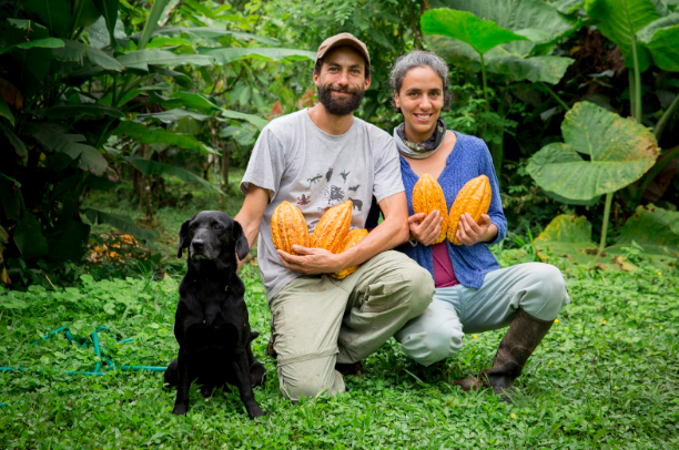 Alejandro and Agostina, conservationists and owners of Ecuadorian Mashpi Artisanal Chocolate Farm educate Purposeful Nomad travelers about sustainable farming while sharing their award-winning handcrafted Arriba Cocoa bars. Jessica Scranton. Purposeful Nomad.