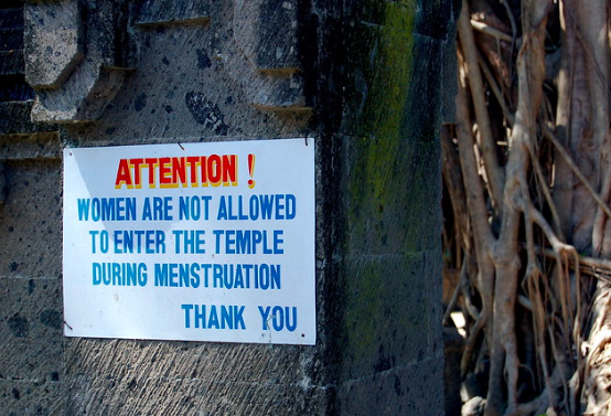 A sign in Bali, Indonesia, demonstrates stigmatization of menstruation in the Global South. dominique bergeron. CC BY-NC-ND 2.0