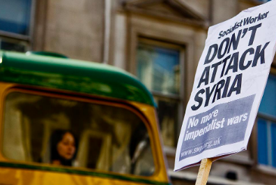 Protestor sign in London. chrisjohnbeckett. CC BY-NC-ND 2.0.