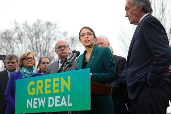 Representative Alexandra Ocasio-Cortez speaks on the Green New Deal with Senator Edward Markey. Senate Democrats via Wikimedia Commons. CC BY 2.0