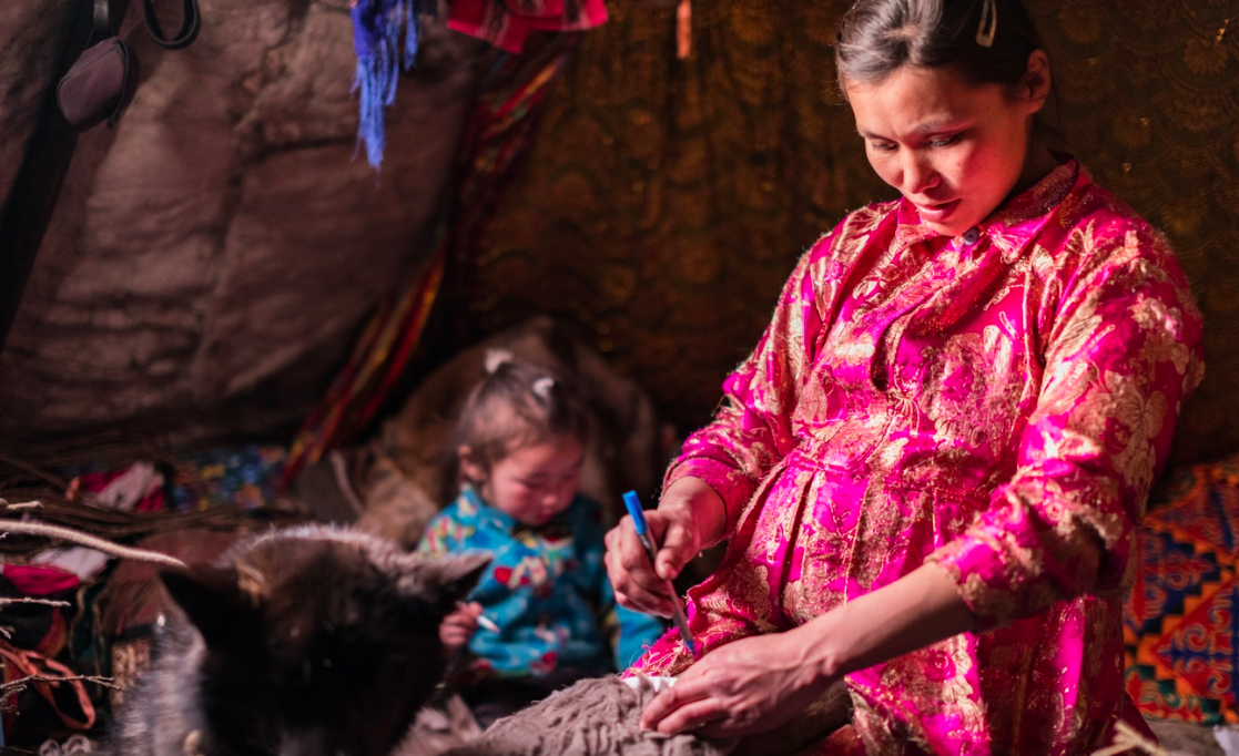 Lena fills her free time with making clothes for her family. Each item of a Nenets’ winter costume is taken from a specific part of the reindeer. For example, the hides used for boots are cultivated in middle of the winter to ensure the thickest fur.