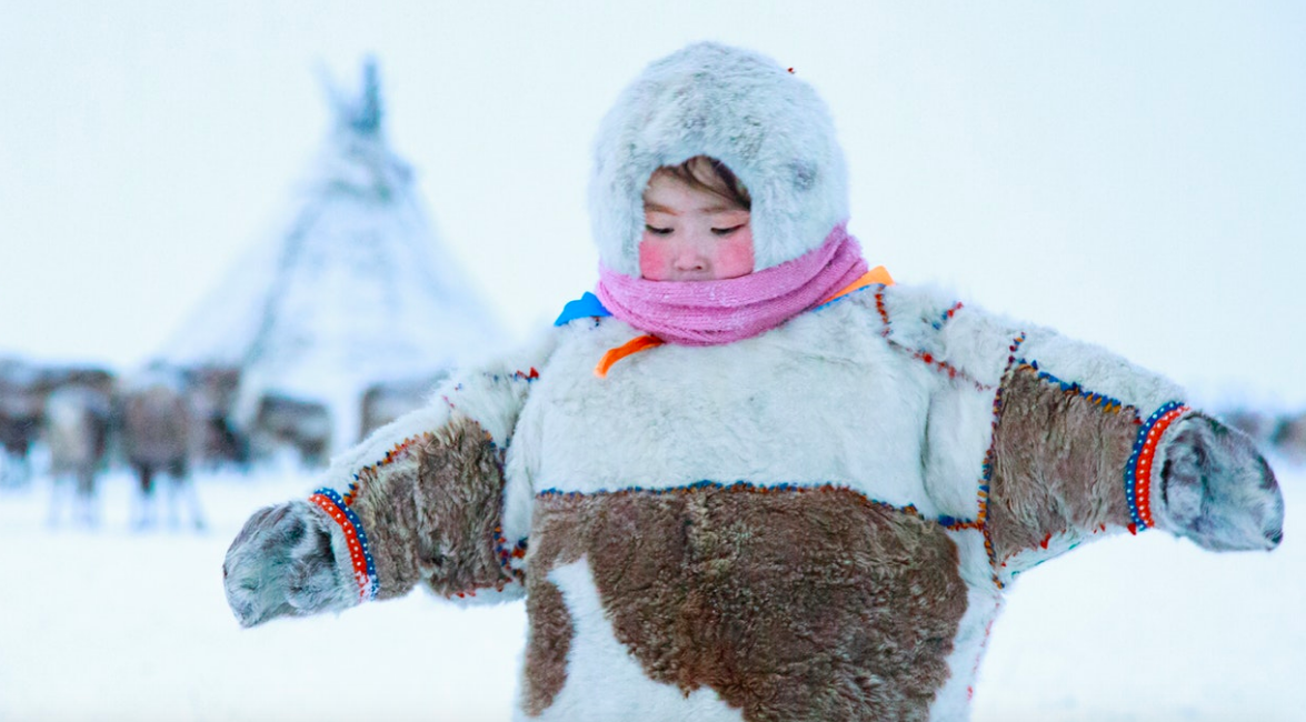 The elements are no match for traditional Nenets’ winter costume. Dressed properly, Christina can play outside for hours./ prints available