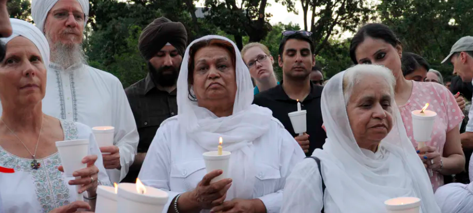 People participate in a candlelight vigil near the White House to protest violence against Sikhs in 2012. AP Photo/Susan Walsh