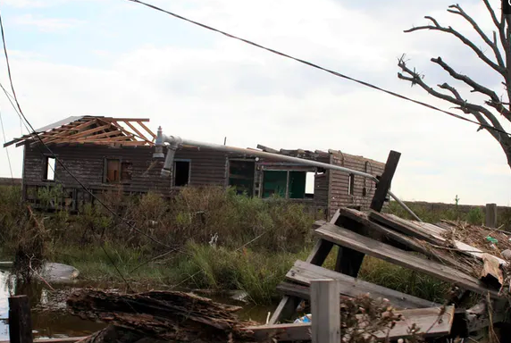 Property damaged by extreme weather and later abandoned on Isle De Jean Charles. Maitri/Flickr , CC BY-NC-SA
