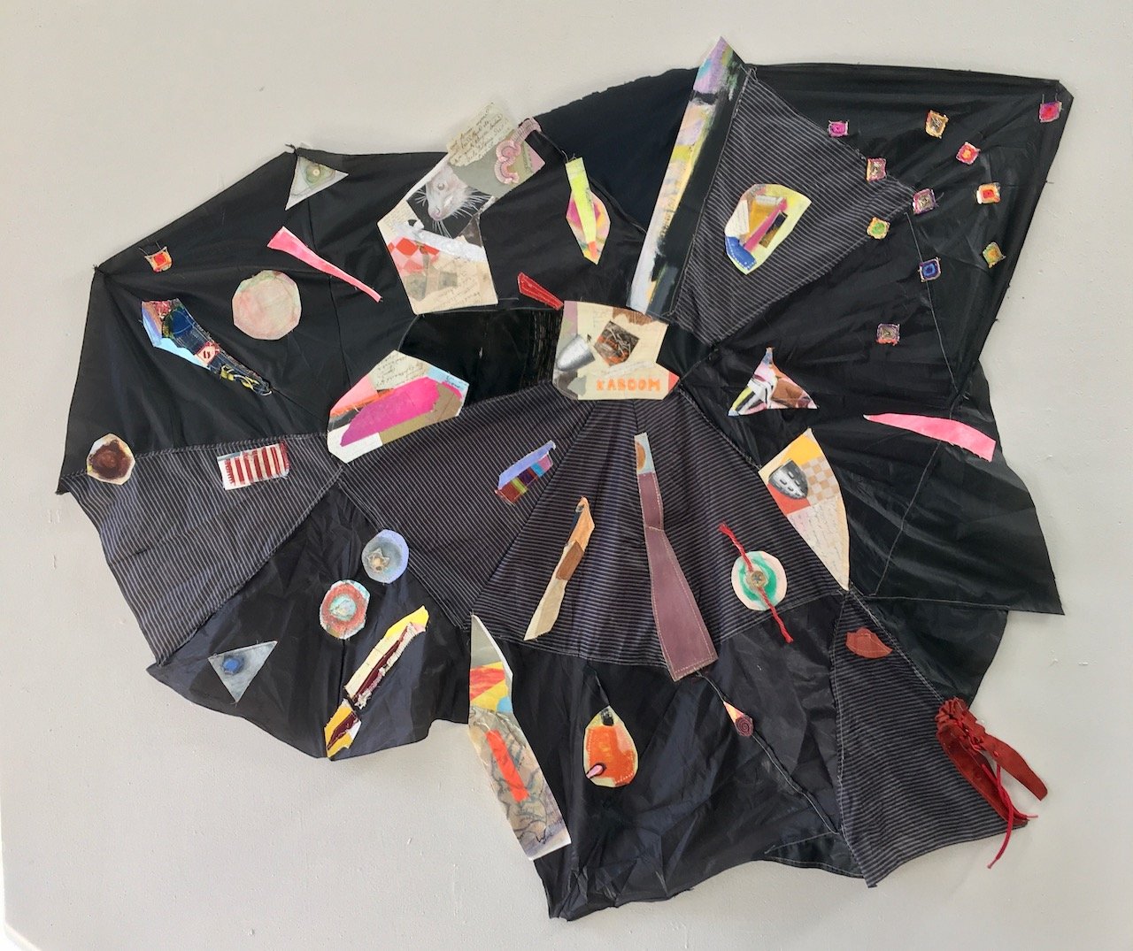 Kaboom (don't be afraid, baby); textiles, paper collage, sewing on umbrella fabric; ca 58" x 63" x 2"; 2022