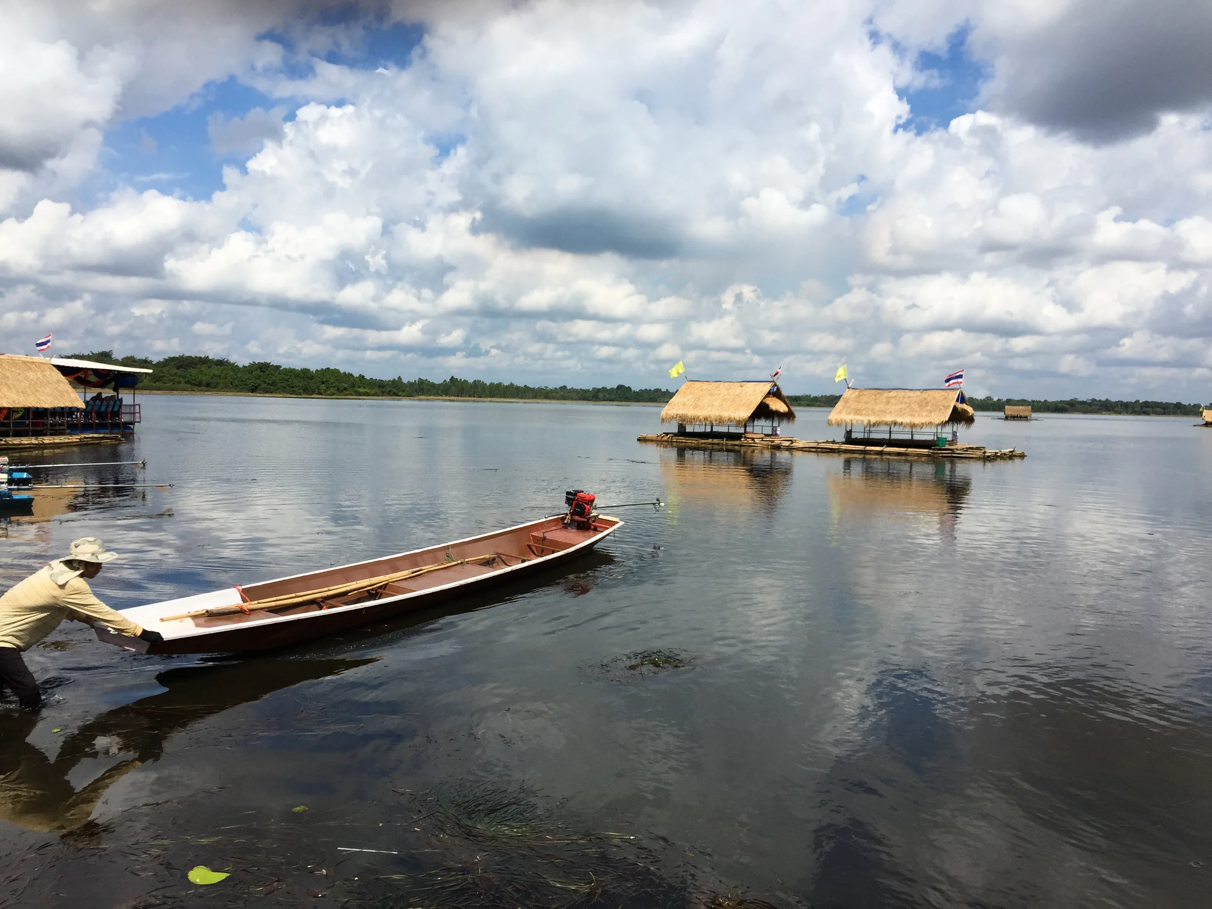  Sometimes this guy is in control. He pulled our raft (the thatch covered hut in the distance) out to an anchor in the lake. Don't worry, every travel doctor recommends fresh water swimming in Thailand.