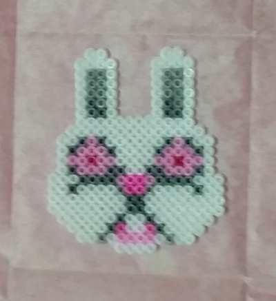 Fuzzy Bunny. He obviously doesn't photograph well. But he's flipped and ready to be covered up in paper for his second ironing.