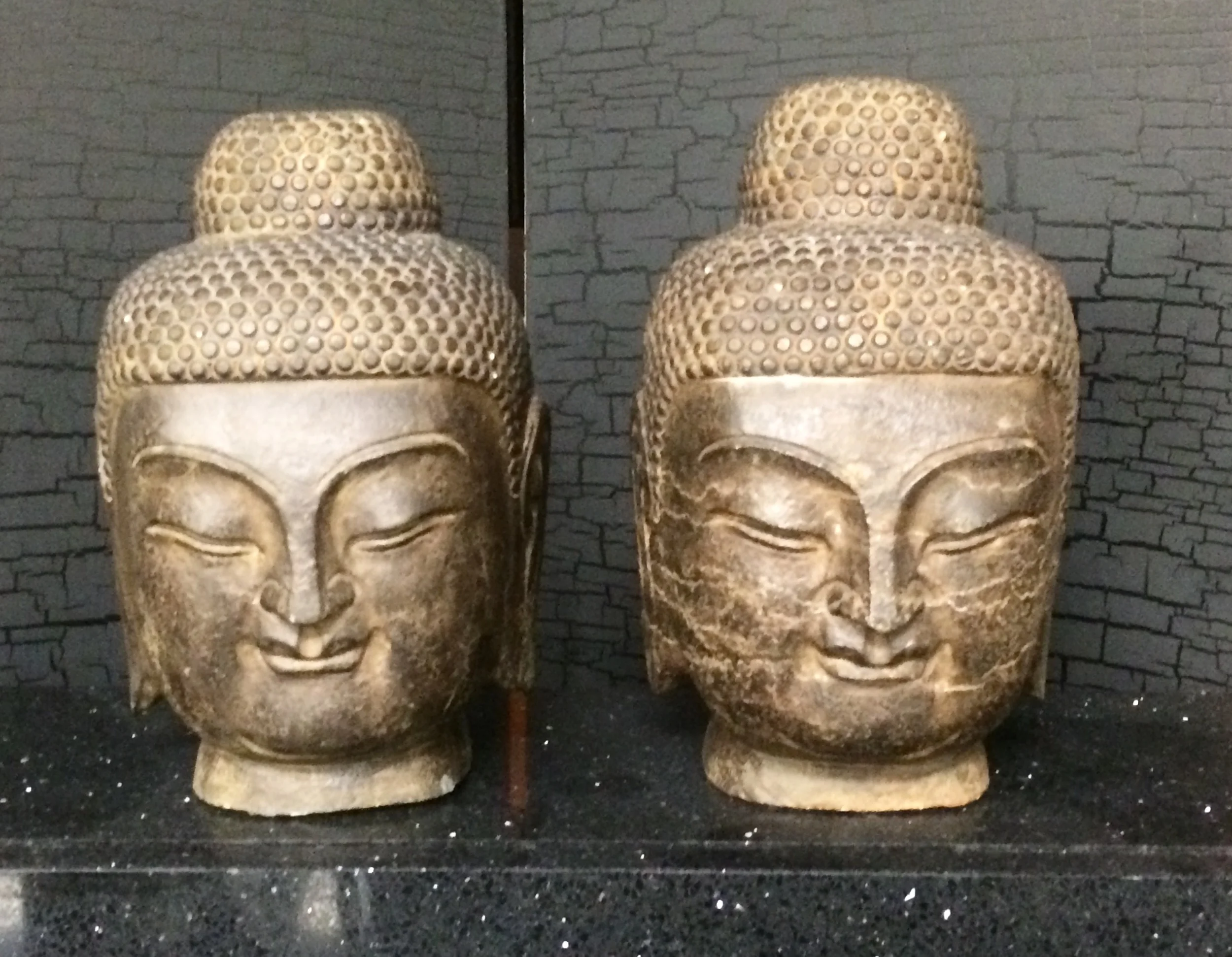 SOLD      Pair antique cast metal Buddha heads