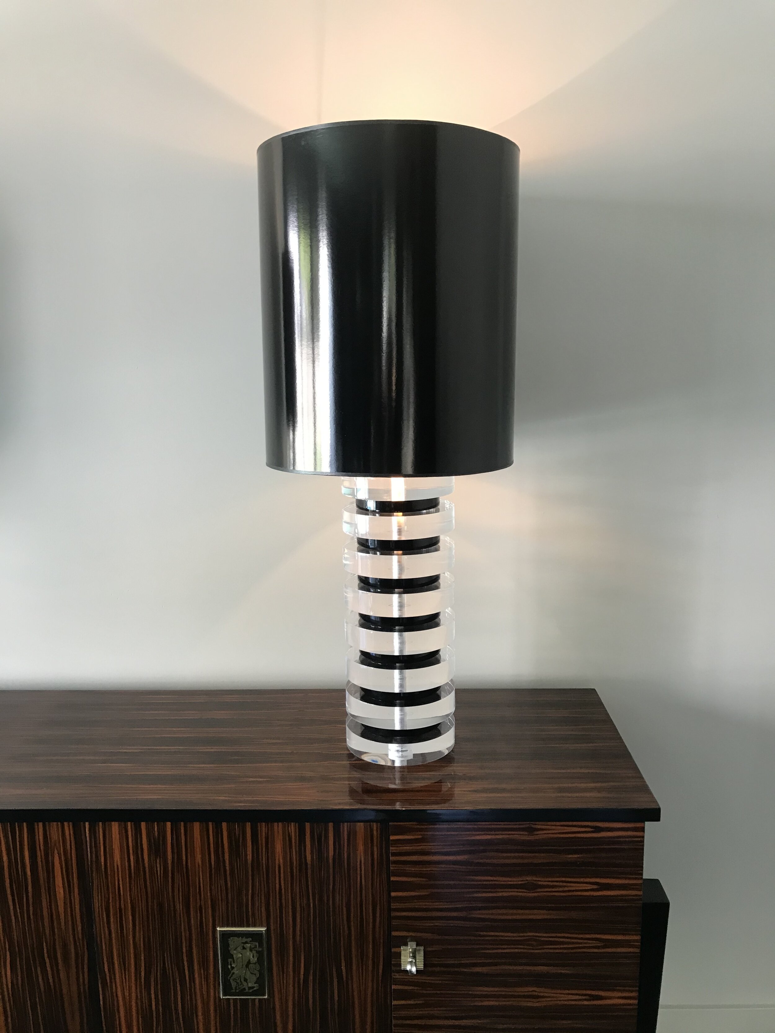Available to order custom made clear and black stacked Lucite lamp in a variety of sizes and designs.