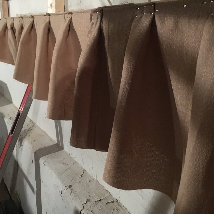 The team behind the Iowa's rehabilitation does a "sample run" of what it will be like to attach the wall drapes. After securing the top to the wall, the drapes will be tightly pleated and secured again. March, 2017.