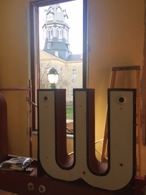 A throwback photo of the marquee's temporary home inside the Iowa's second floor office, overlooking the beautiful Winterset courthouse.