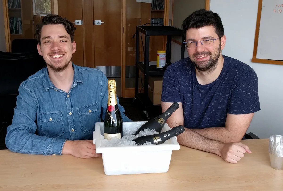 CHRISCHI AND ASAF CELEBRATE OUR PAPER'S ACCEPTANCE.