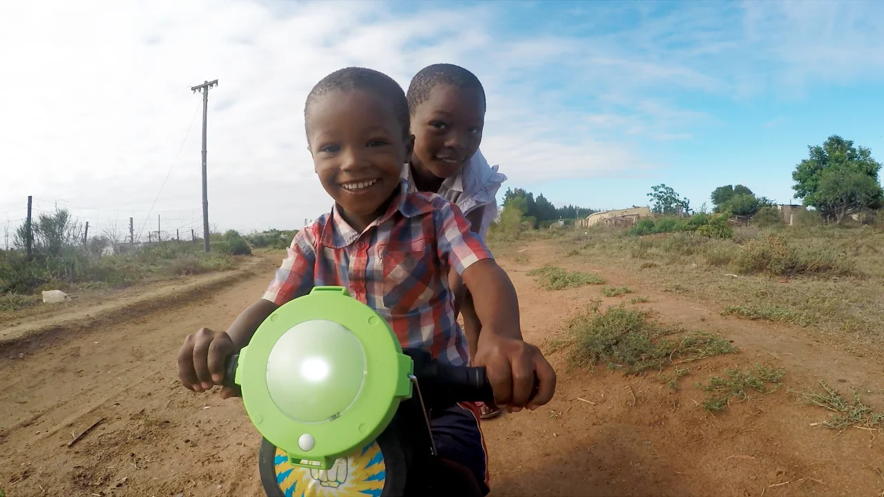 We had a great time in early 2016 distributing solar powered LED lights made by Naturally Solar ! These lights, which can also be used to charge a cell phone, were a huge hit in Langbos, Addo - an informal settlement with no electricity. Distributing these lights was part of our larger census project where we went door-to-door to every single home in Langbos conducting an in-depth census to gather information on health, employment, education, safety, and other topics to learn more about the Langbos community. This census will provide incredibly valuable data to help identify the greatest needs and opportunities in the community. We are currently compiling this data, as well as some great footage from this project, and we look forward to sharing more soon! Thank you to Naturally Solar for your generosity and help with this project! And thank you to the Langbos community for welcoming us into your community and homes-- it was a pleasure to get to know you all better and we look forward to future projects in Langbos! 