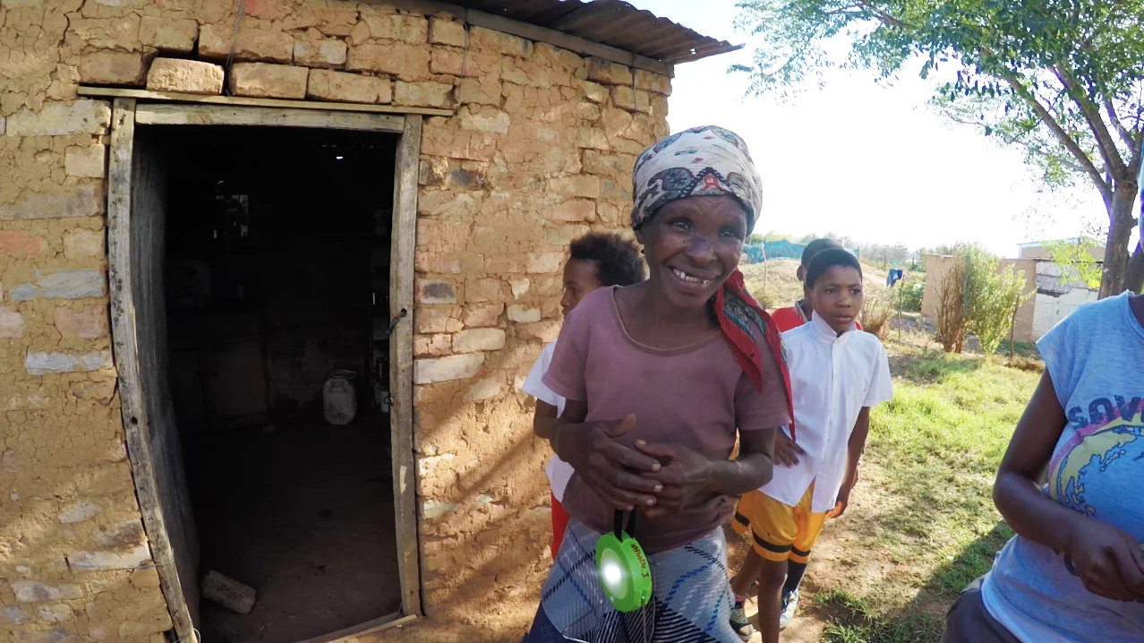 We had a great time in early 2016 distributing solar powered LED lights made by Naturally Solar ! These lights, which can also be used to charge a cell phone, were a huge hit in Langbos, Addo - an informal settlement with no electricity. Distributing these lights was part of our larger census project where we went door-to-door to every single home in Langbos conducting an in-depth census to gather information on health, employment, education, safety, and other topics to learn more about the Langbos community. This census will provide incredibly valuable data to help identify the greatest needs and opportunities in the community. We are currently compiling this data, as well as some great footage from this project, and we look forward to sharing more soon! Thank you to Naturally Solar for your generosity and help with this project! And thank you to the Langbos community for welcoming us into your community and homes-- it was a pleasure to get to know you all better and we look forward to future projects in Langbos! 