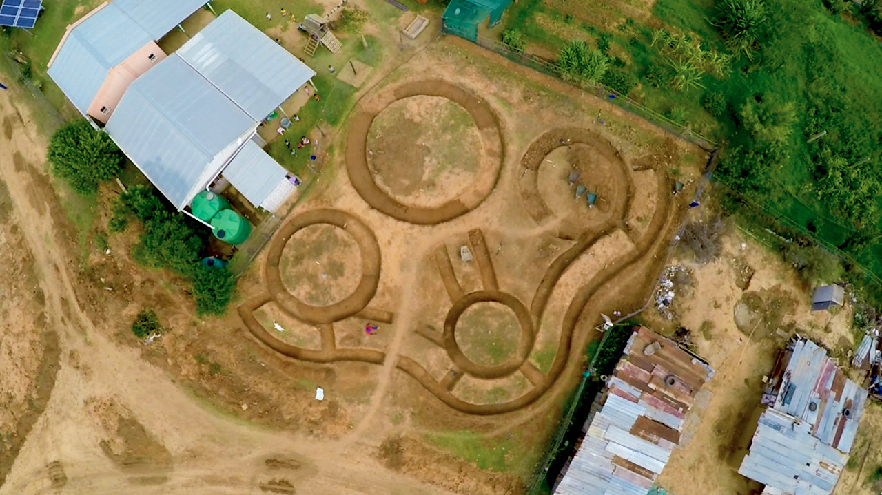 Trenches dug for foundations, revealing the basic blueprint for the shelter.