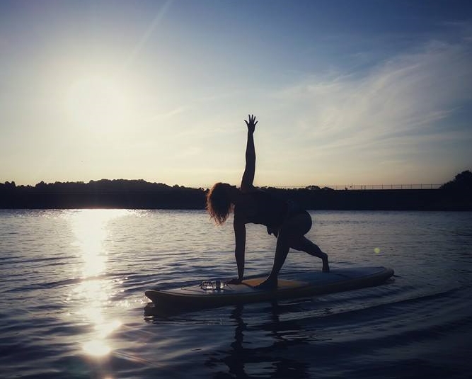 Colleen playing with balance on Round Valley Resevoir, NJ. Photo by Melanie Smith .