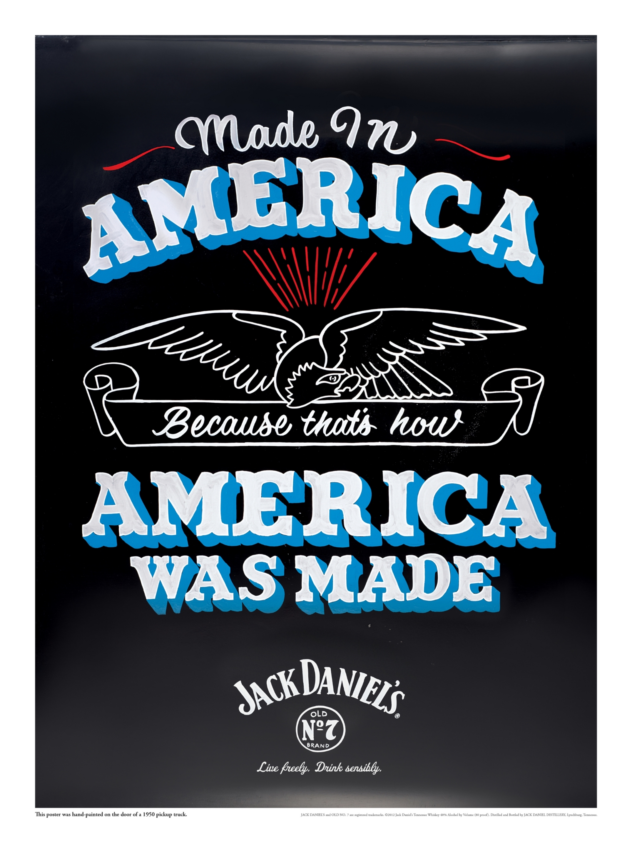 This poster was handpainted on the door of a 1950 GMC pickup truck.