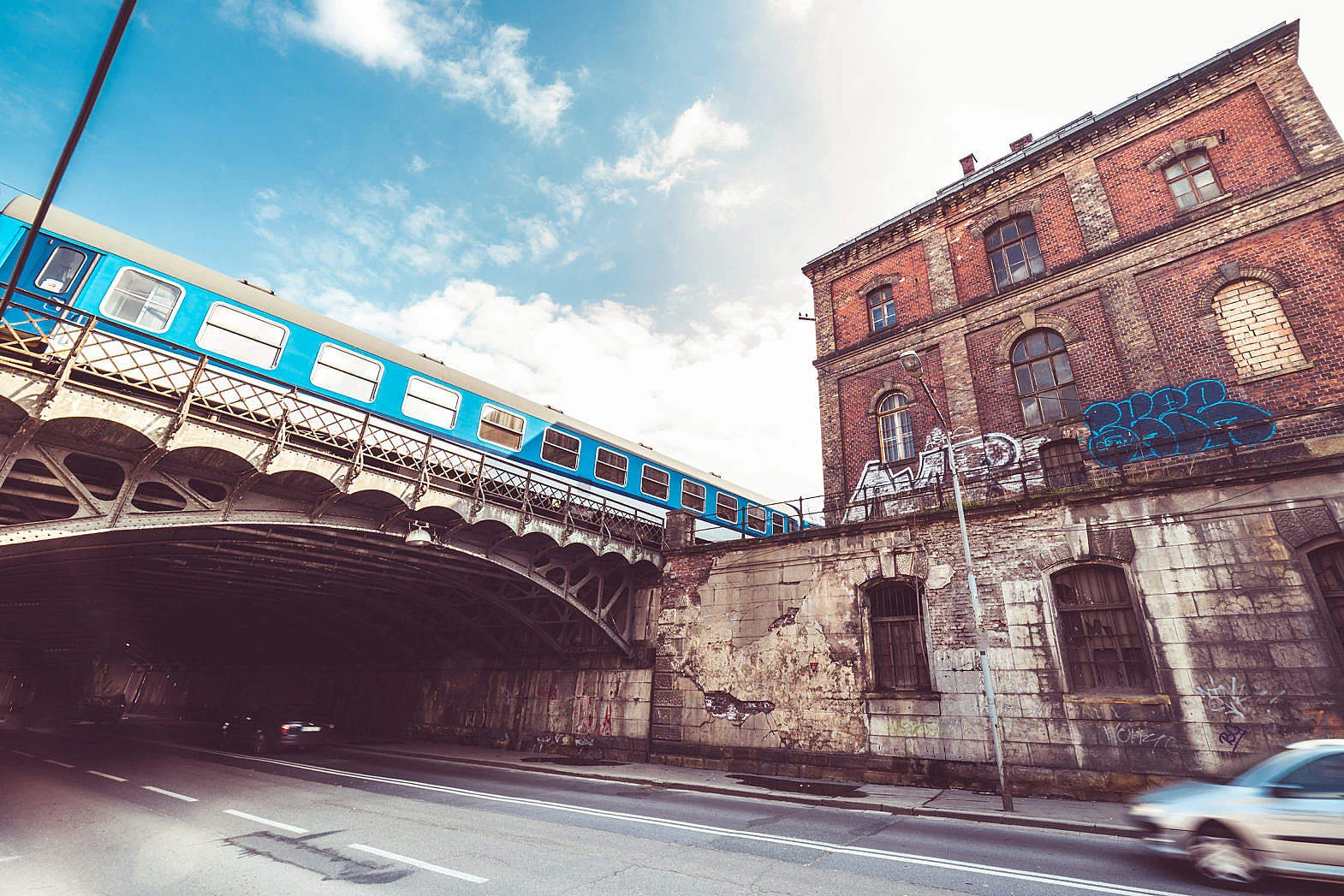 old-abandoned-building-with-steel-railway-bridge_free_stock_photos_picjumbo_DSC04142-1570x1047.jpg