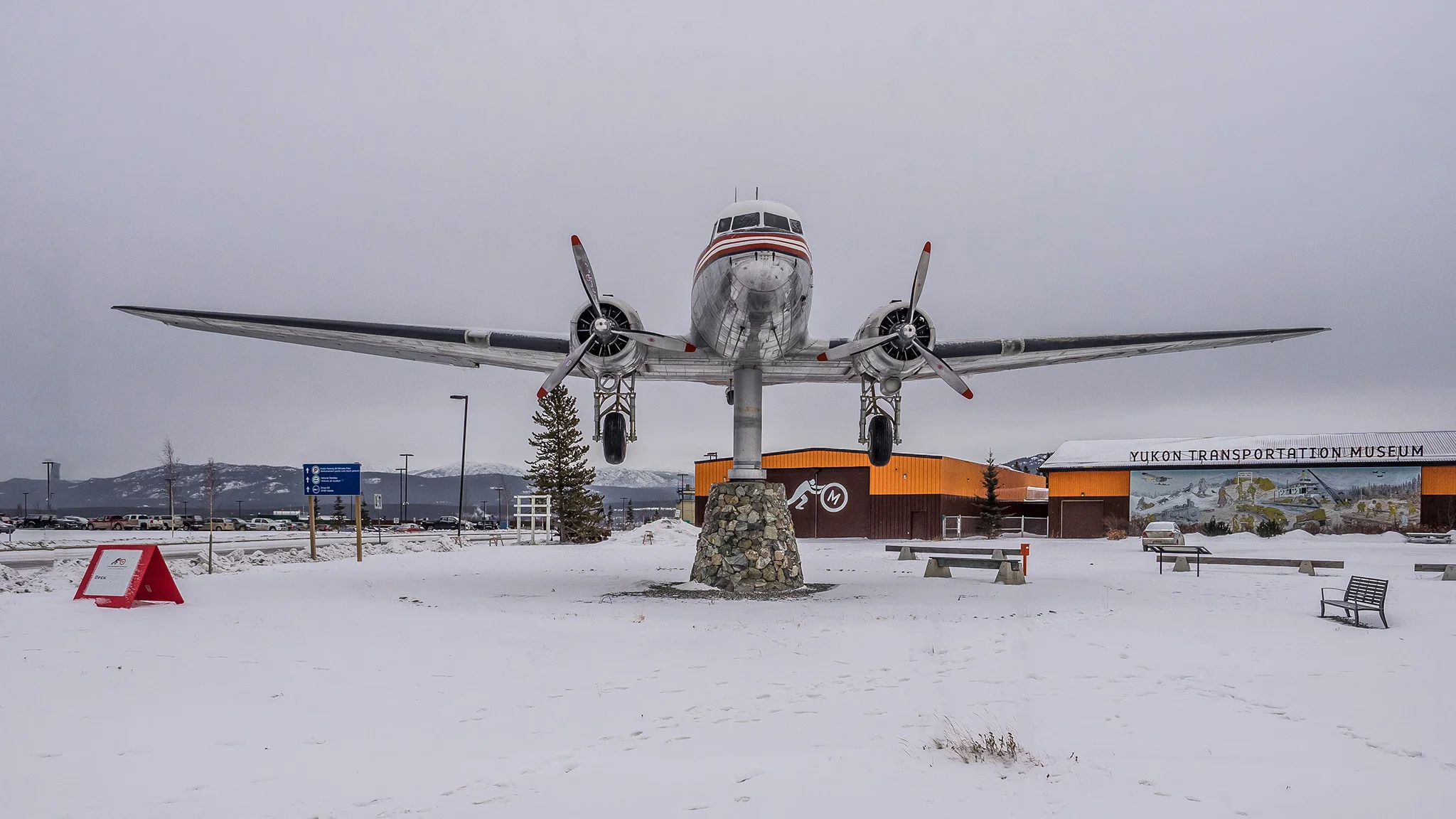 The worlds largest Weathervane, A Douglas DC-3 airplane sits on a pedestal in front of the Yukon Transportation Museum in Whitehorse.