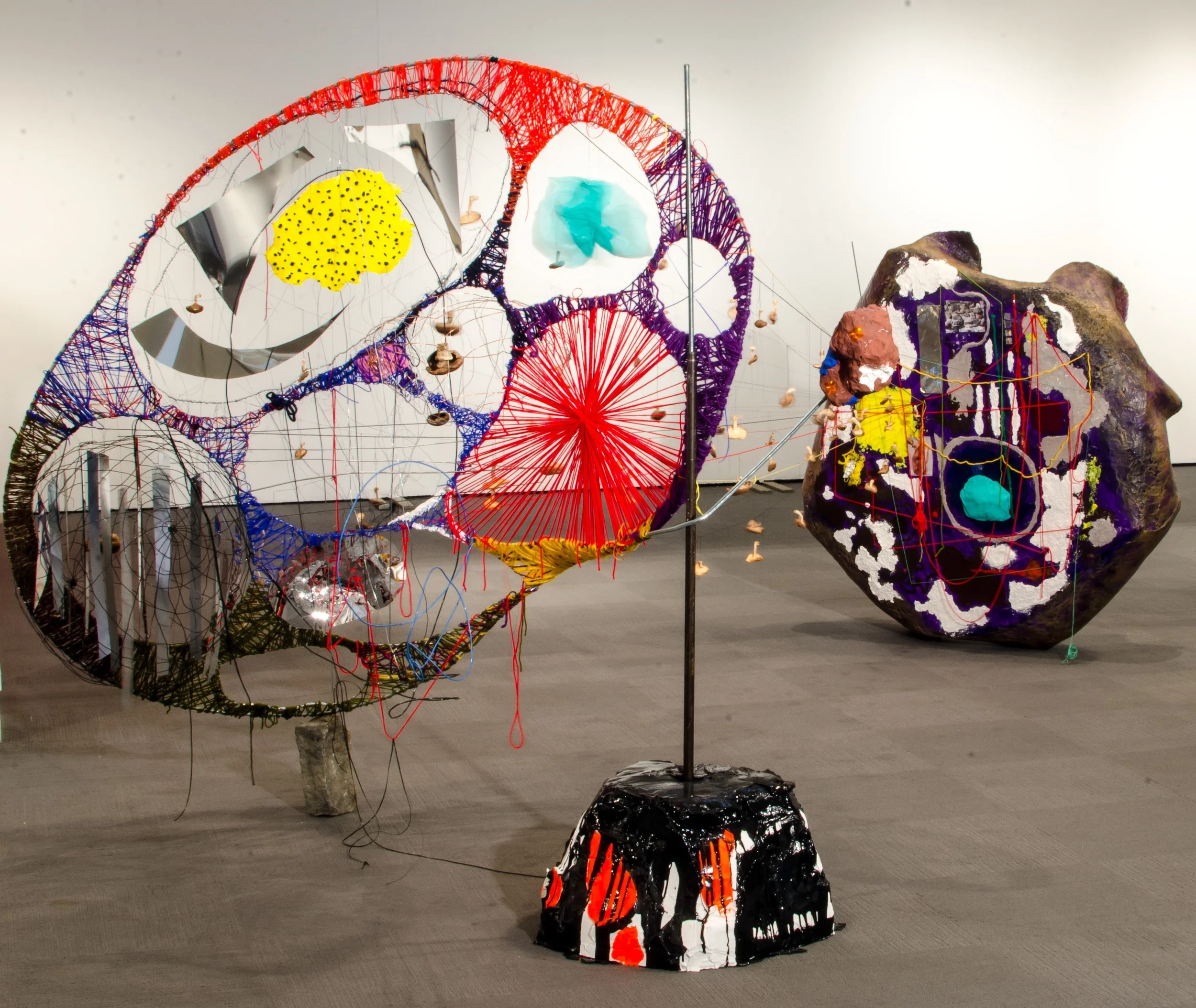 Self-Reflexive Narcissistic Supernova. Metal, yarn, thread, wire, plastic bags, plastic lace, papier-maché, photos, mylar, clay, screws, acrylic, wood, beeswax, dried mushrooms, cobblestone
