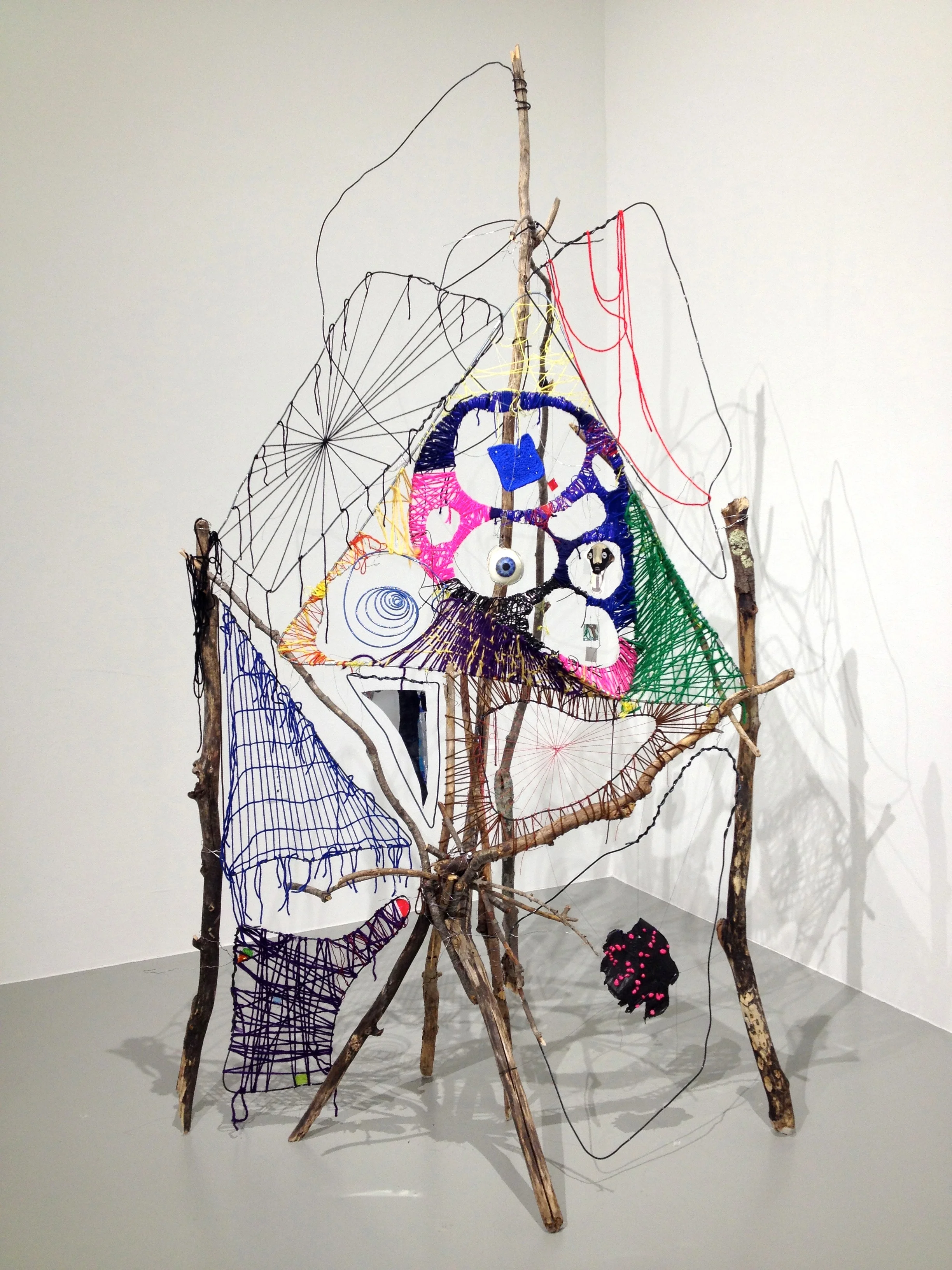 Foot of a Grimy, 2016, 87" x 45" x 48", Sticks, wire, yarn, thread, mylar, beeswax, paper, plaster, pebbles, acrylic paint skin, pushpins, plastic-coated wire