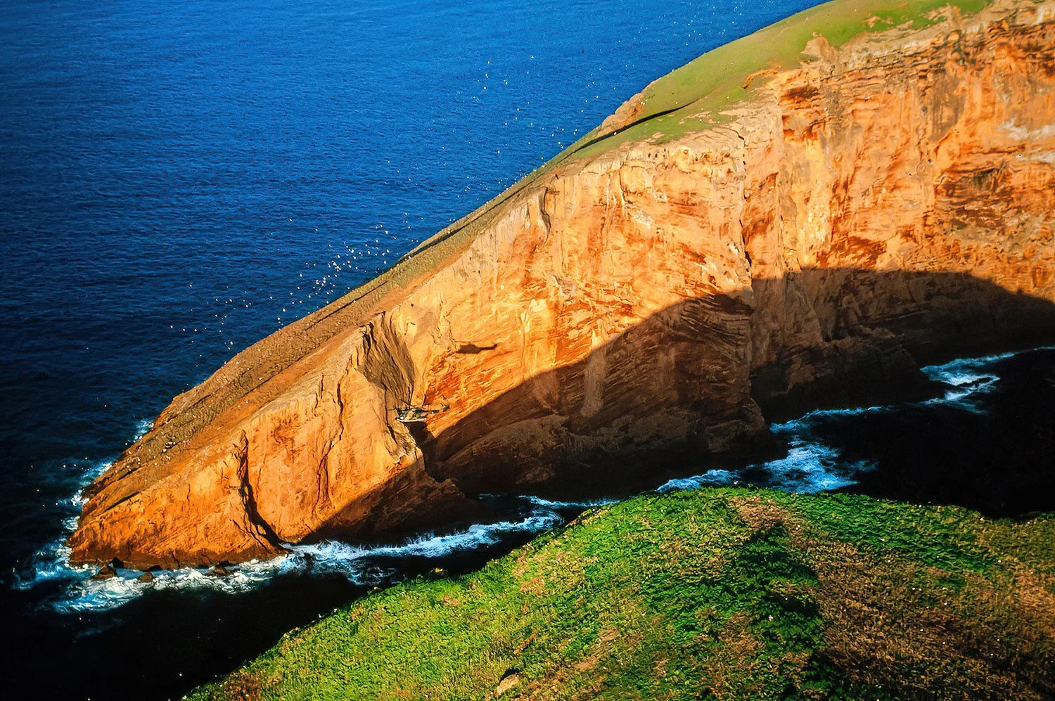 An aerial photo of Terceira, Azores, Portugal.  Right off the coast of Terceira are the tiny volcanic islets called the Ilhéus das Cabras.