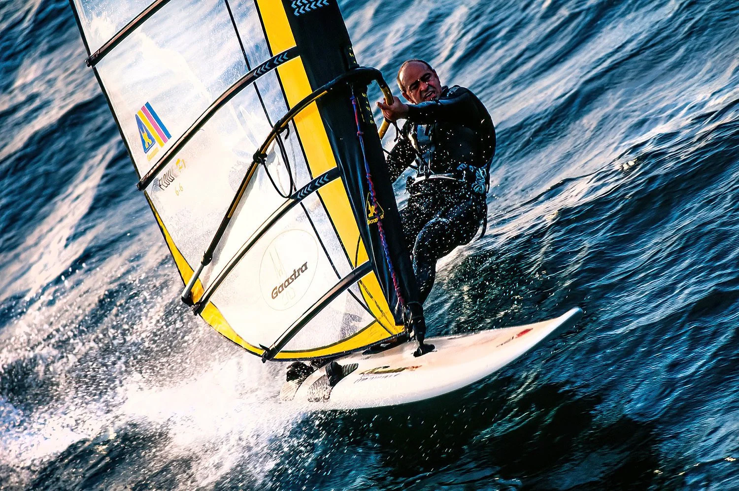 An aerial photo of windsurfing in Portugal.  Portugal’s strong Atlantic winds and long coastline make it a top destination for windsurfing.