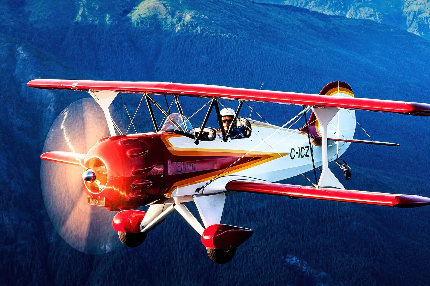 An aerial photo of a Murphy Aviation "Spirit" biplane in the Fraser Canyon, BC, Canada
