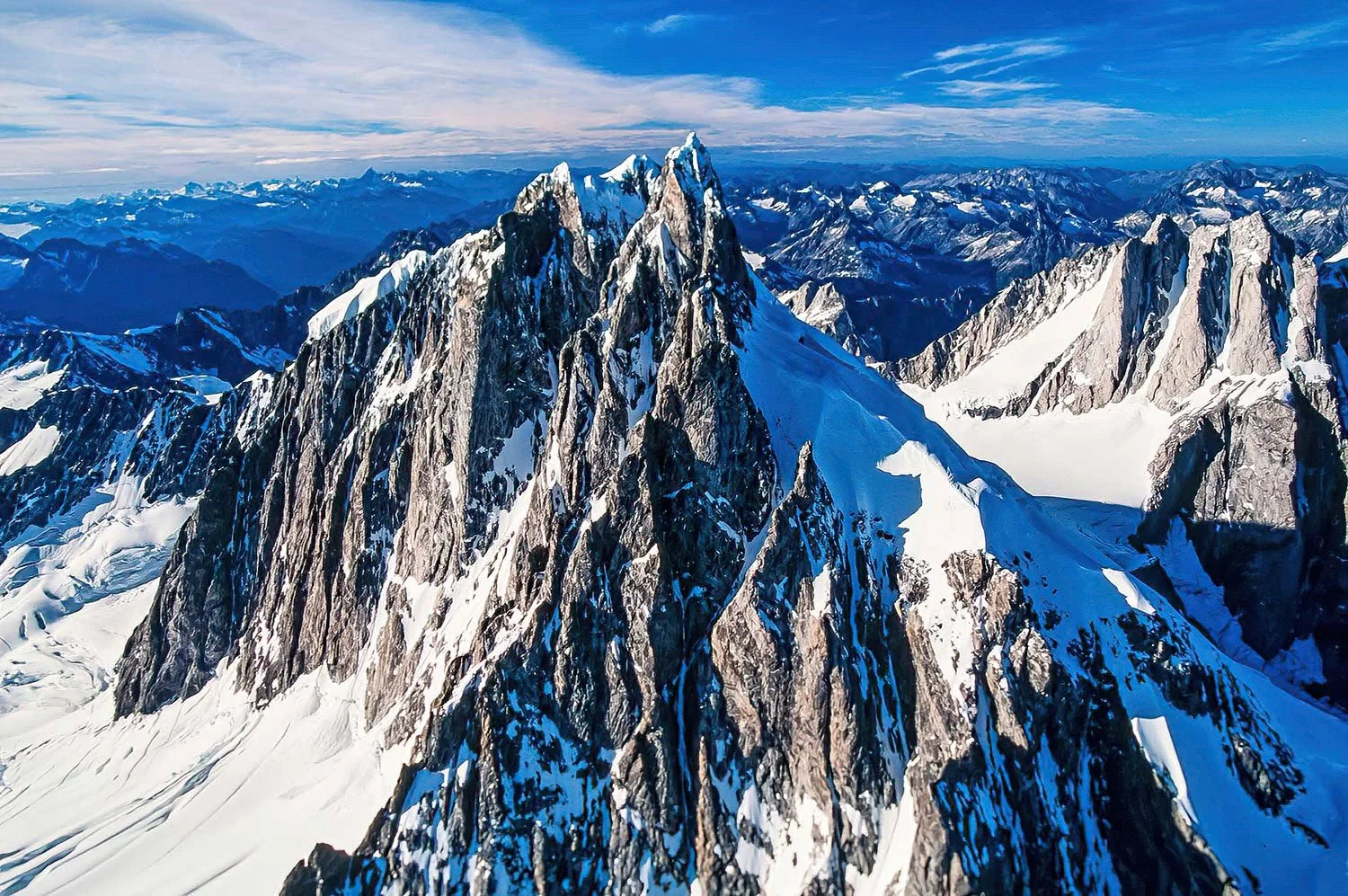 An aerial photo of Mt. Waddington, BC, Canada.  Famous for its remote, rugged terrain and challenging climbs that attract only the most skilled mountaineers.