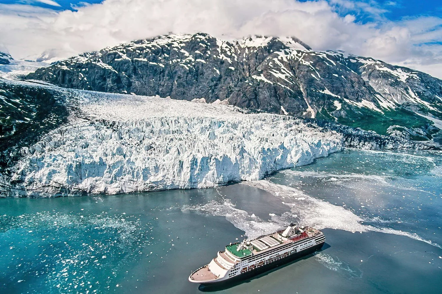 An aerial photo of Glacier Bay National Park, Alaska, USA.  Glacier Bay National Park is a breathtaking wilderness of tidewater glaciers, fjords, and abundant wildlife along Alaska’s rugged coast.