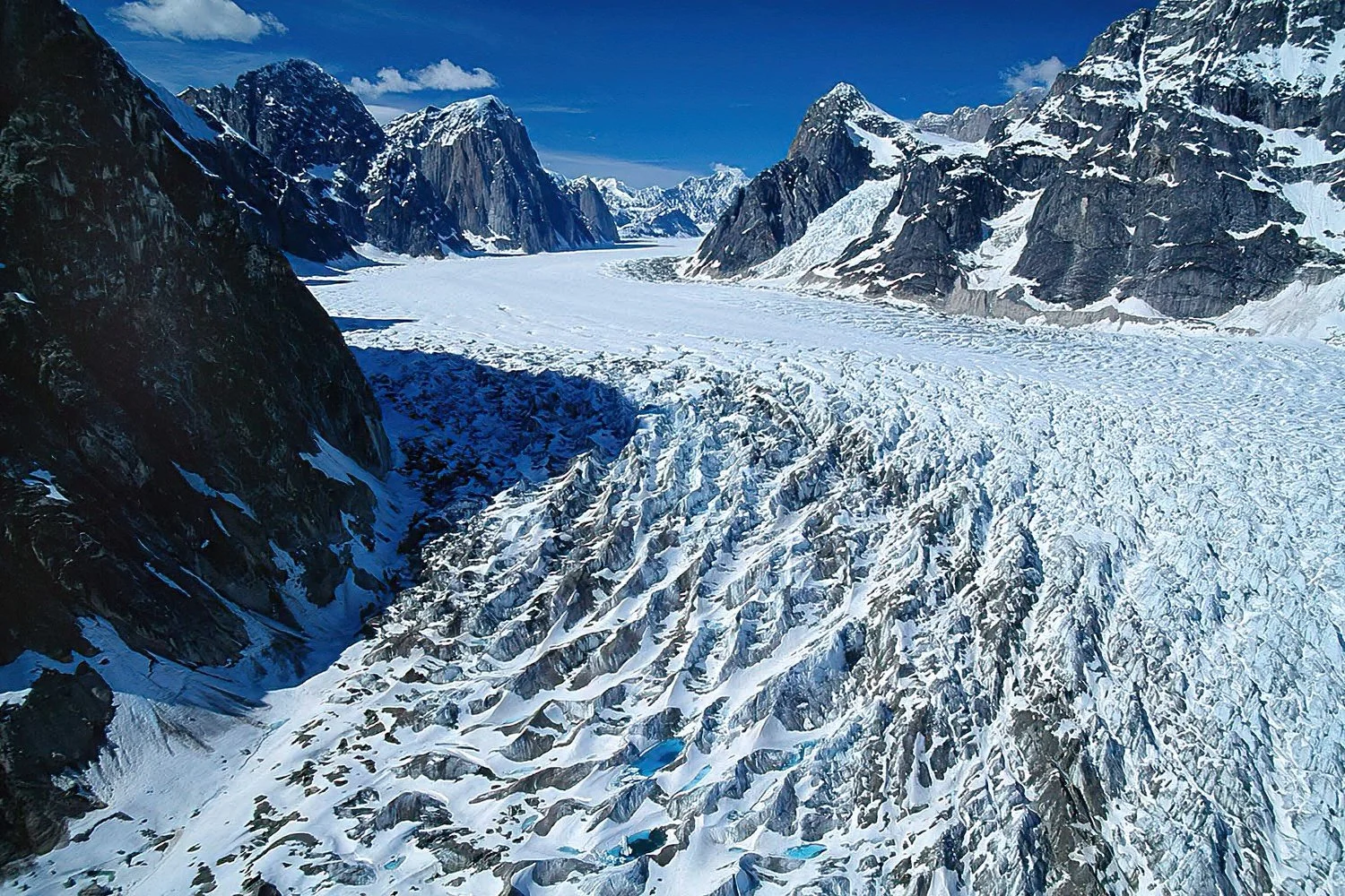 An aerial photo of Denali National Park, Alaska, USA.  Denali National Park is home to hundreds of glaciers—flowing rivers of ice fed by snow and ice high in the Alaska Range.