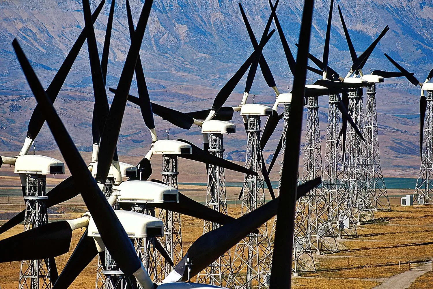 An aerial photo of the Pincher Creek windmill turbines, Alberta, Canada.  They are large wind energy turbines that harness the region’s strong prairie winds to generate renewable electricity.