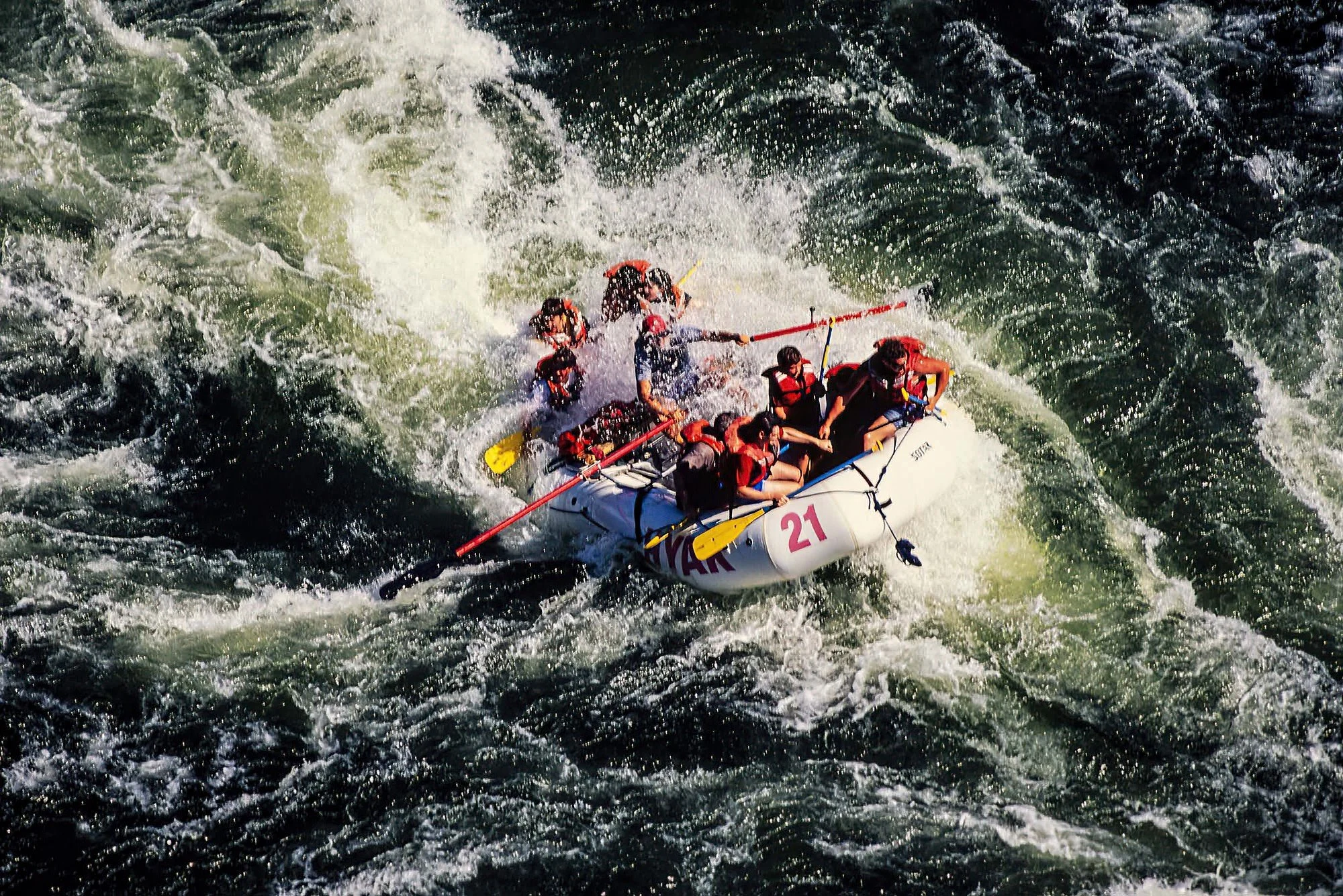 An aerial photo of whitewater rafting Fraser River, BC, Canada.  A thrilling adventure through BC’s rugged landscapes, with powerful rapids, scenic canyons, and adrenaline-pumping river excursions.