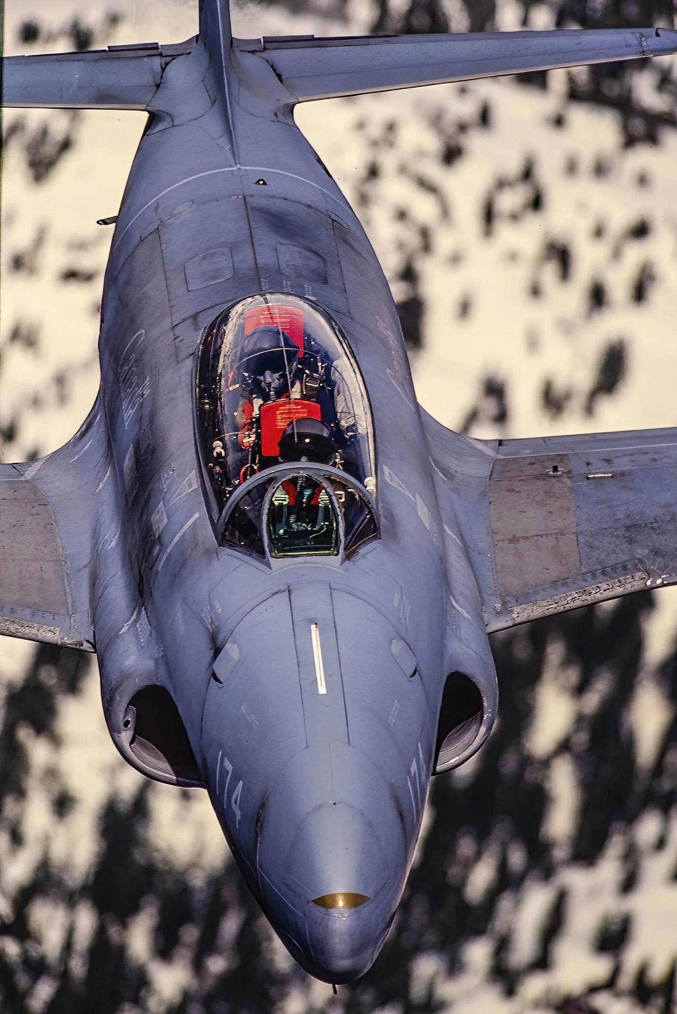An aerial photo of a Lockheed T-33 "T-Bird" over Vancouver Island, BC, Canada.  Renowned for its reliability and role in post-World War II aviation development.