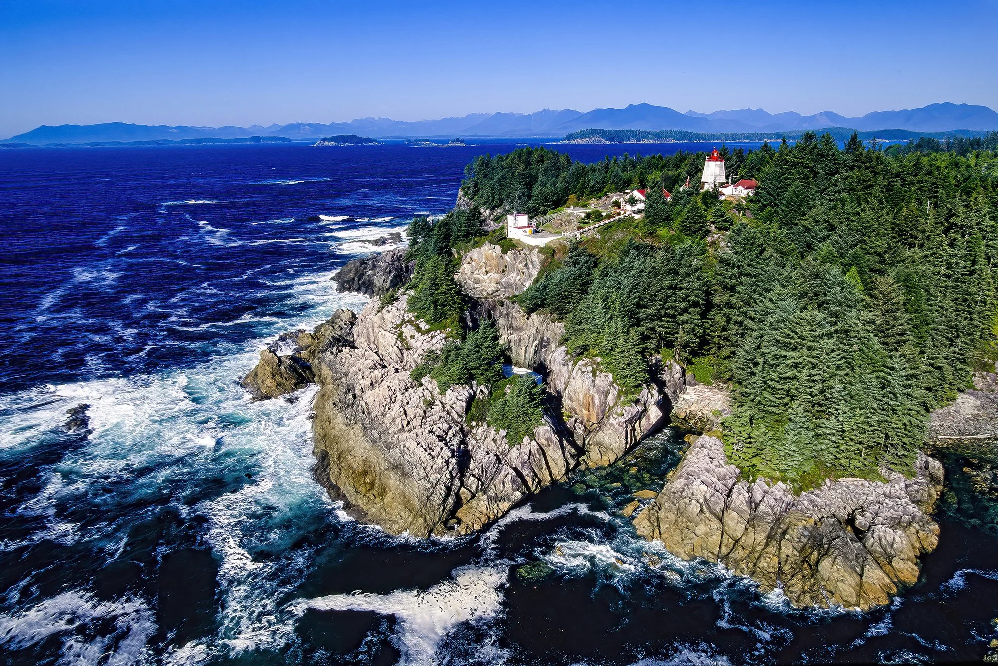 An aerial photo of Cape Beale Lighthouse, Vancouver Island, BC, Canada.  It  is a historic coastal lighthouse known for its remote location and scenic ocean views.