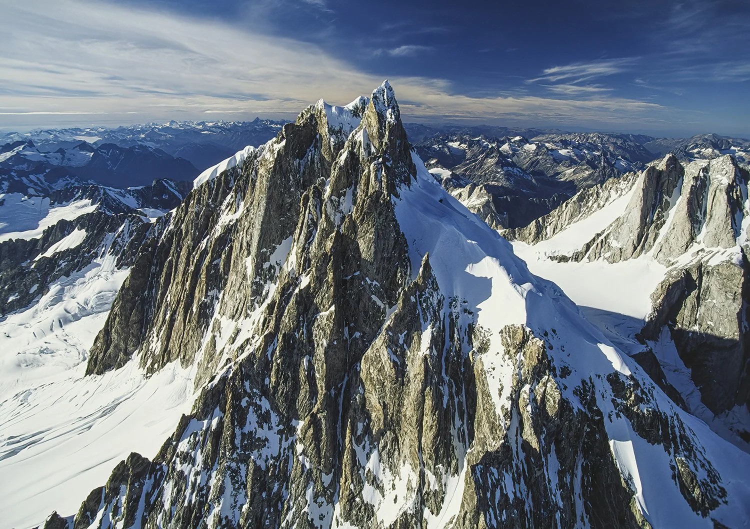An aerial photo of Mt. Waddington, BC, Canada.  Famous for its remote, rugged terrain and challenging climbs that attract only the most skilled mountaineers.