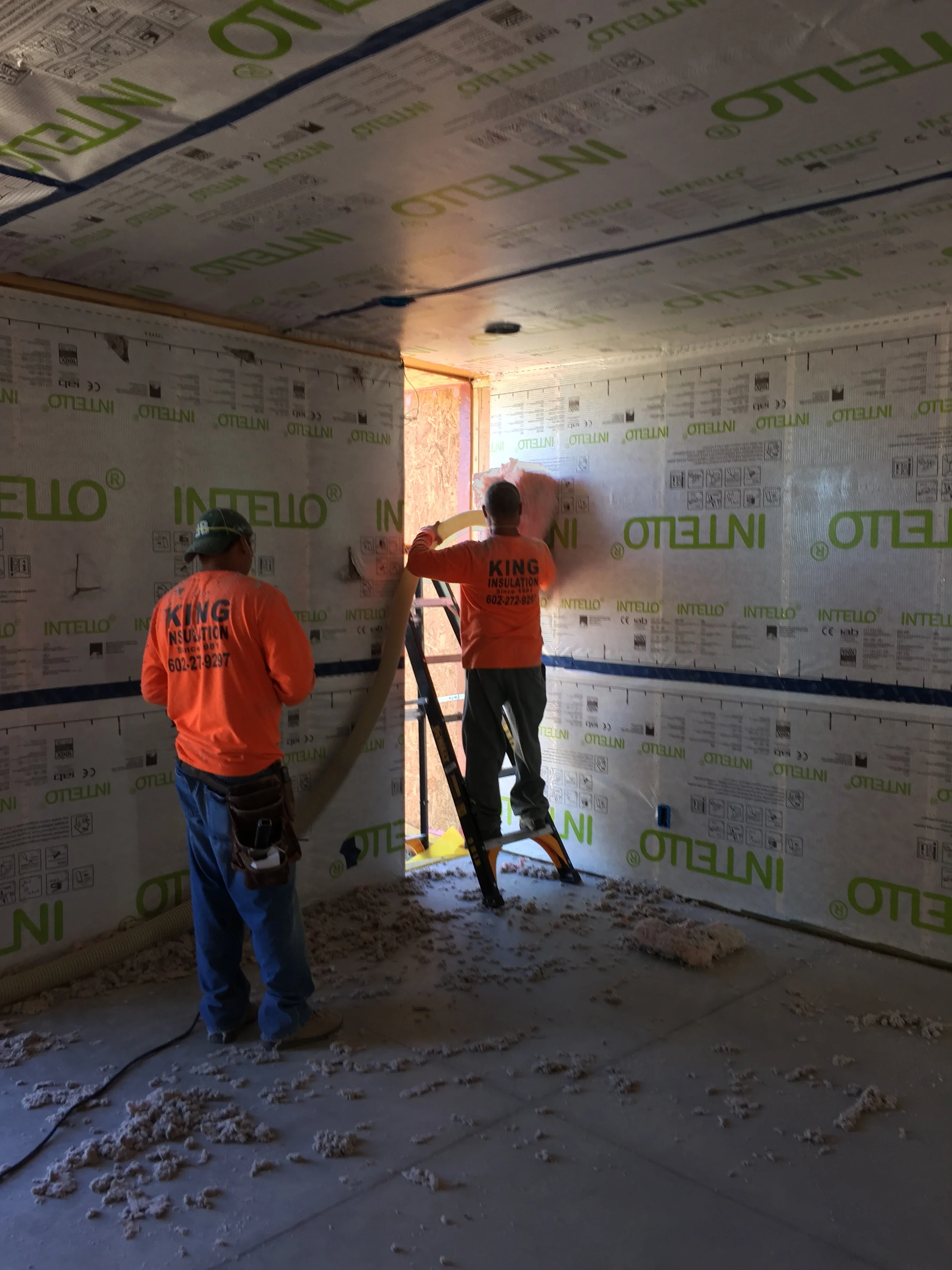 Applying blow-in cellulose insulation. 100% recycled content and more effective than conventional insulation. Much less prickly to work with too. And all the "waste" you see on the floor can be swept up and put back into the blower, so there is ZERO waste!