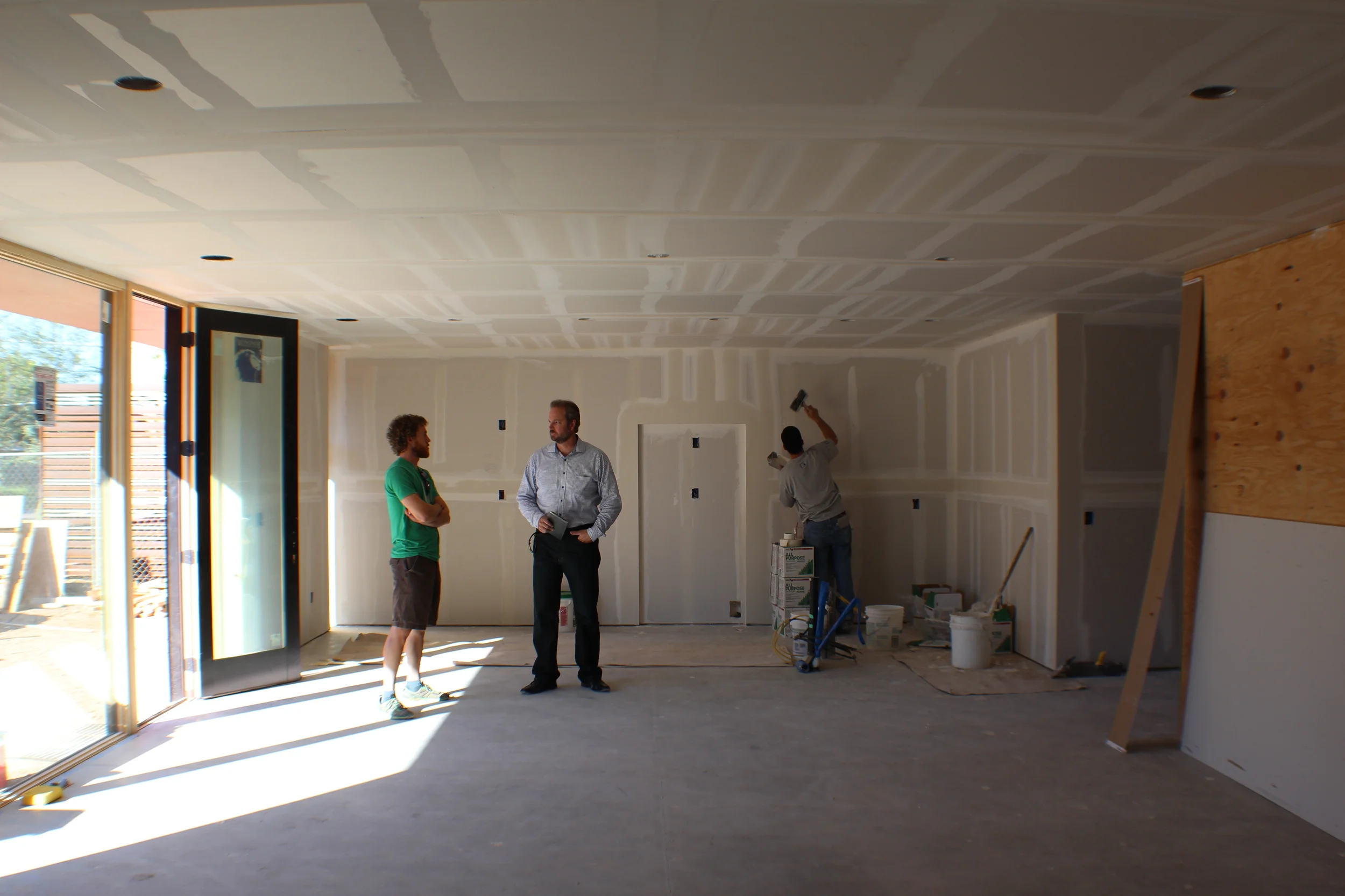 The interior is nearing completion as well. Doors and windows are installed. Gypsum Board is getting textured (smooth, of course).