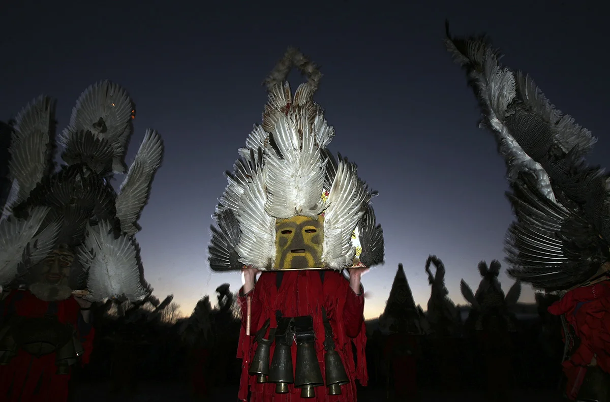 Bulgarian dancers known as a "kukeri" perform a ritual dance during which its believed they will scare away the evil spirits and encourage agricultural fertility for the coming year, near the town of Pernik, Bulgaria. The Kukeri ritual is attributed to Thracian origins and is world known as an annual celebration in Bulgaria, but can also be found in parts of some other Balkan states. The participants in the traditional annual celebration make their own multi-colored masks, covered with beads, ribbons and woolen tassels. Every Kuker takes part in the ritual dance while the main dancer, ladened with bells to drive away sickness and evil spirits, sways like a wheat spikelet heavy with grain.