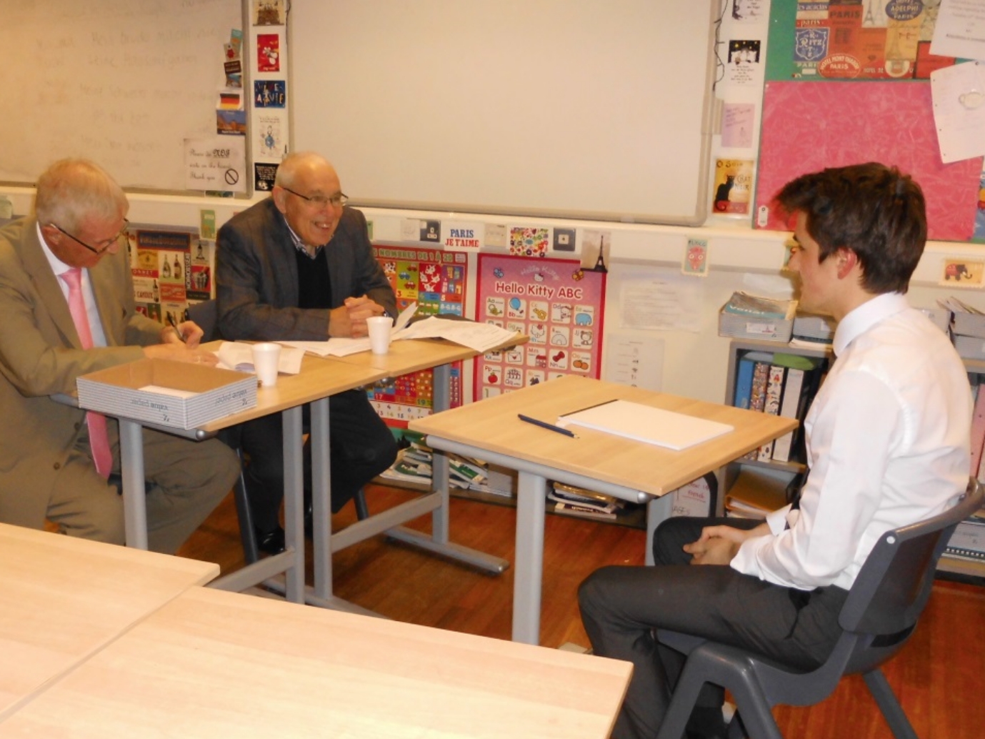 Retired Physics teacher, Bill Wilson, and Dr Beattie (grandparent of pupils and retired Professor of Electrical Engineering) interviewing Kai Jenkins who has applied to study Physics at Oxford.