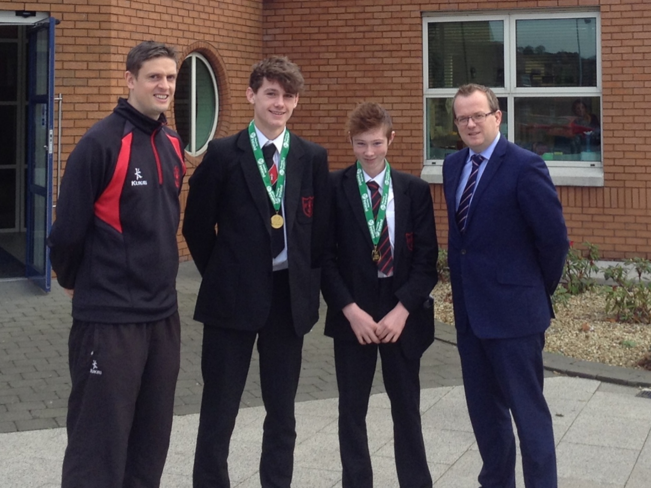 Coach Mr D Robb, with Frazer, Sam, and Mr M Carville, Headmaster