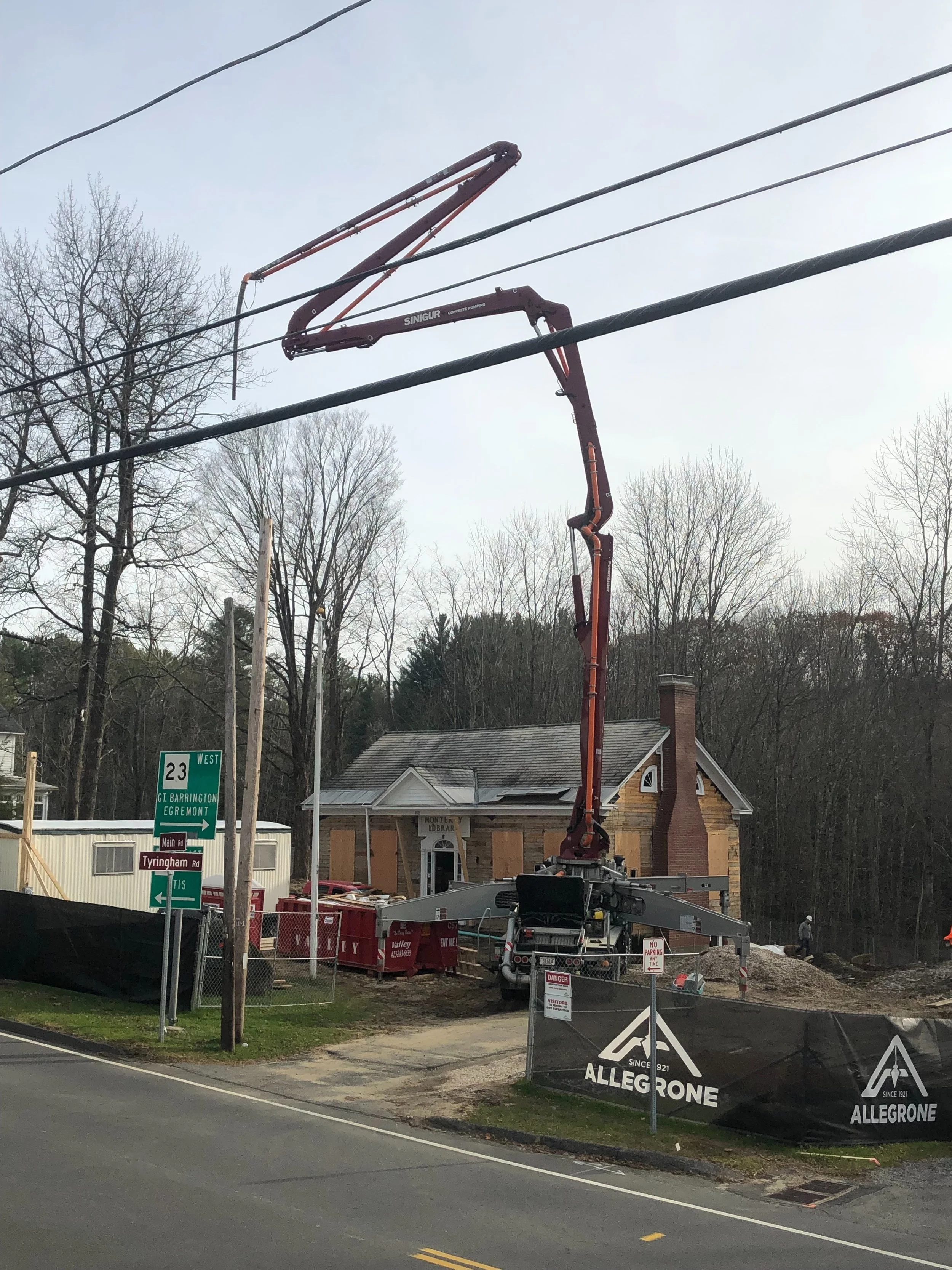 CONCRETE PUMP TRUCK TO GET THE CONCRETE BEHIND THE BUILDING