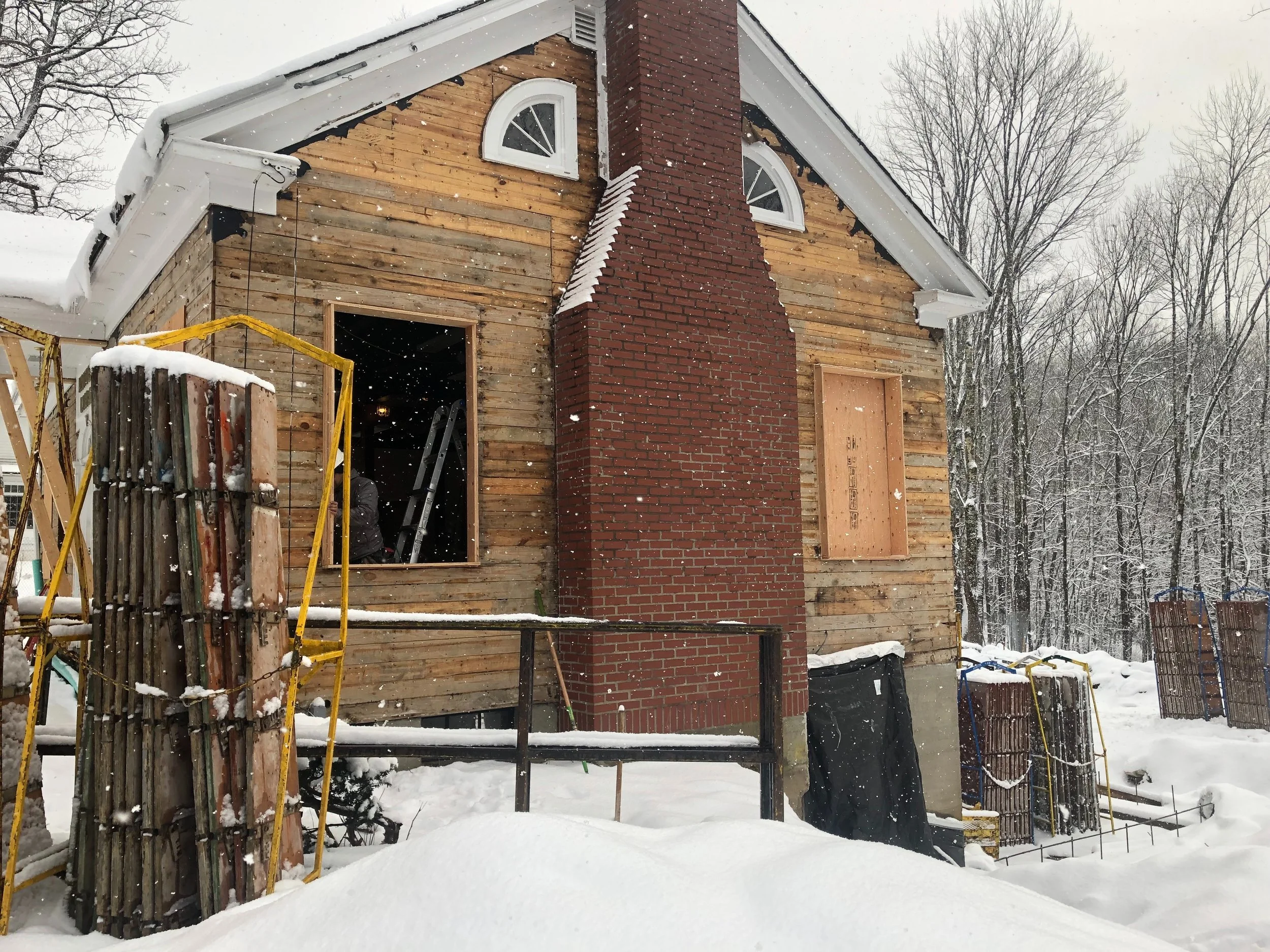 FRAMING THE ORIGINAL WINDOW FRAMES TO PREPARE FOR INSTALLING THE NEW ONES