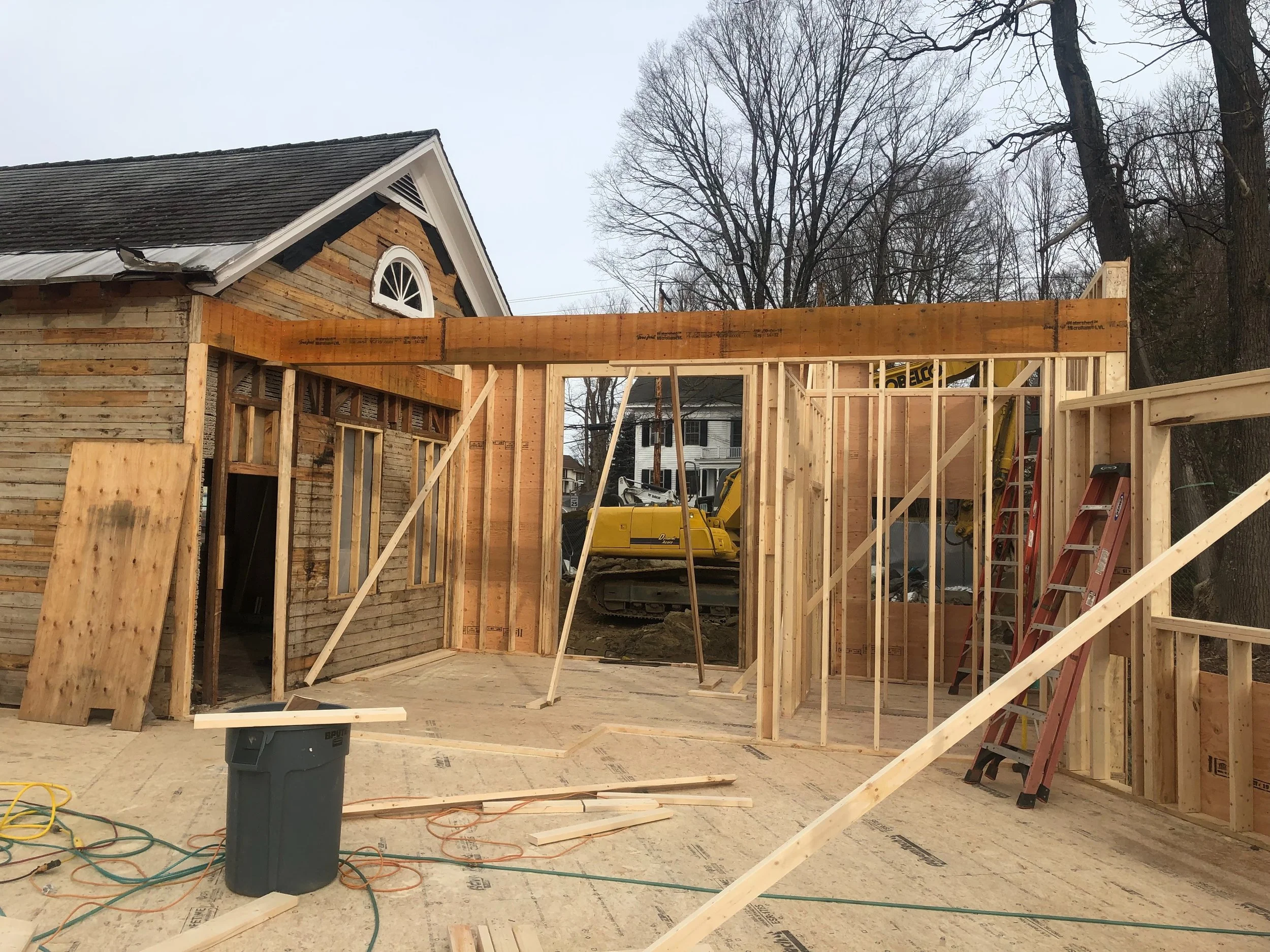 STRUCTURAL BEAM SUPPORTING CEILING AND ROOF OVER ENTRYWAY