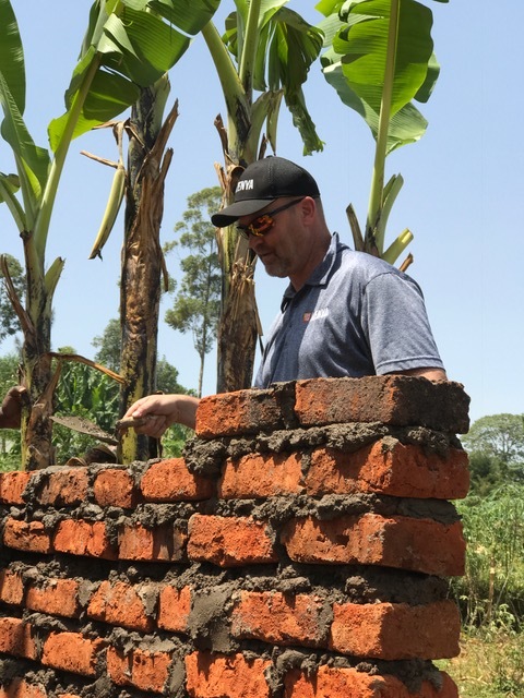 Randy Stensgard helping build Lonika's outhouse.