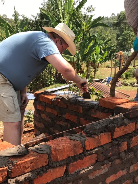 Dave helping with our Kenyan friends to build a brick outhouse