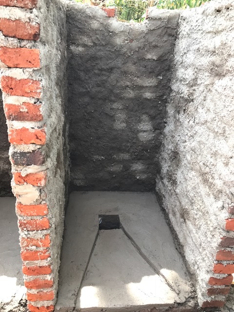 Agness' outhouse is almost complete. She is SO excited!