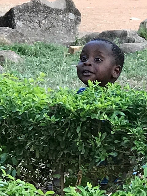 Little Brian playing hide and seek.